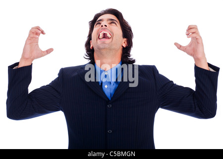 portrait of excited young business man with hands raised in white isolated background Stock Photo
