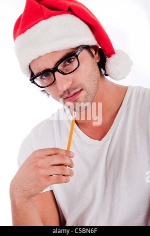 handsome man thinking by wearing santa's hat isolated on white background Stock Photo