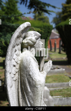 Stone angel praying Stock Photo