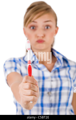 Young women showing the toothbrush on a white background Stock Photo