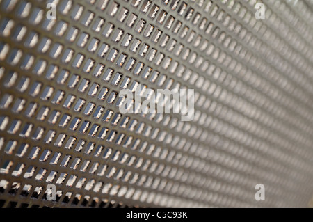 Old metal grid in perspective, short depth of field. Stock Photo