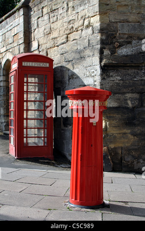 Victorian post box and telephone box at Eastgate, Warwick, UK Stock Photo