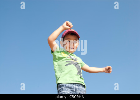 winning,happy boy,jumping, joy Stock Photo