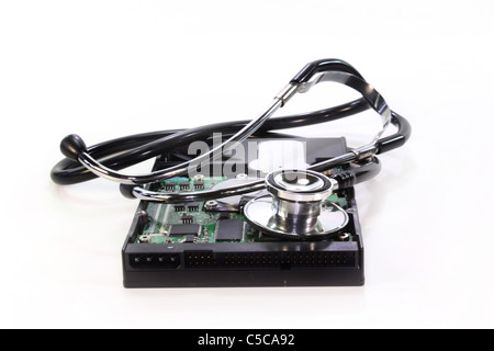 a hard disk and stethoscope on white background Stock Photo