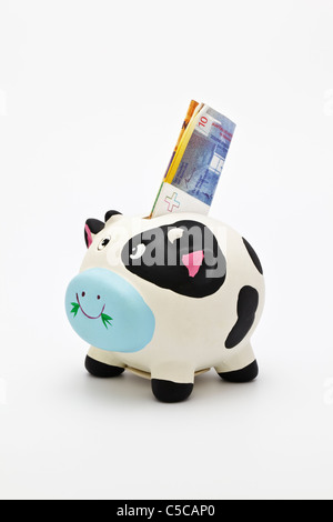 Piggy bank  with a Swiss Banknote of 10 Francs Stock Photo