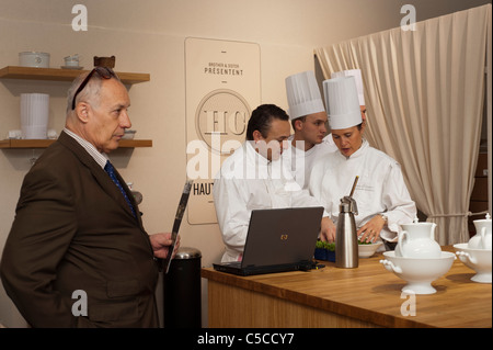 Paris, France, Group French Chefs Working Together at Food and Fash-ion Trade Show, Restaurant, man, laptop computer, group talking inside, Stock Photo