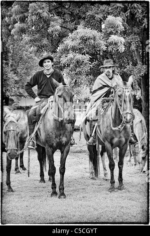 Gauchos with their horses, San Antonio de Areco, Buenos Aires Province, Argentina Stock Photo