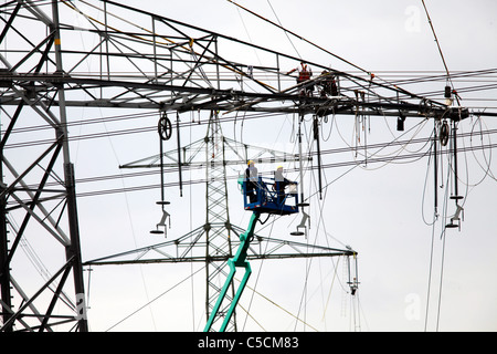 Construction of new High-voltage power lines. New electricity pylons. Germany. Stock Photo