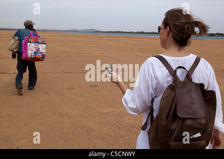 Woman using cell phone in Mali West Africa Stock Photo