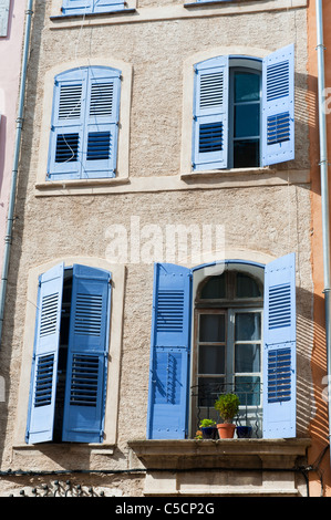 Typical French facade with blue shutters at the windows Stock Photo