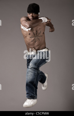 African dancer in motion on grey background Stock Photo