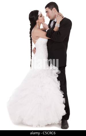 Newly married couple loving each other over white background Stock Photo