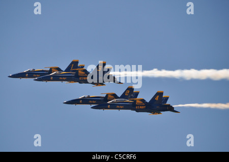 Four Blue Angels jets roar overhead. Stock Photo