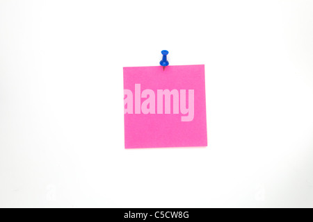 a pink note paper with a blue steel pin Stock Photo