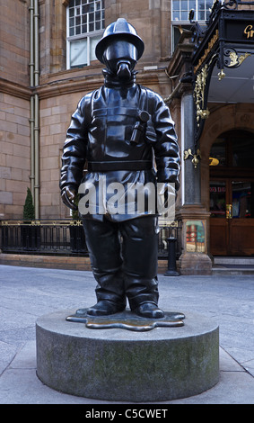 Statue of 'citizen Firefighter' by Kenny Hunter, Gordon Street, Glasgow, Scotland, UK. Stock Photo