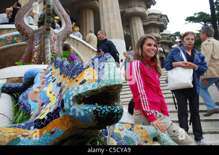 posing near the famous lizard in Parc Guell Barcelona Spain Stock Photo