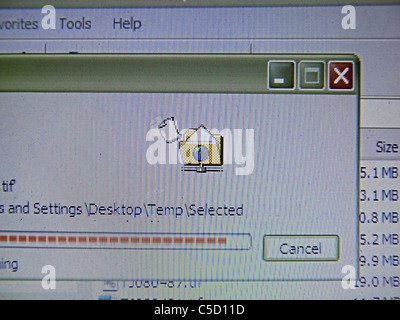 Close up of computer monitor showing process of copying Stock Photo