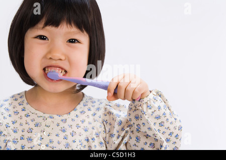 girl brushing her teeth Stock Photo