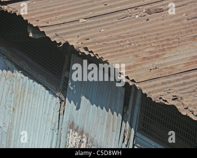 Shed made of galvanized sheet for the workers working on construction site, India Stock Photo