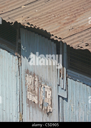 Shed made of galvanized sheet for the workers working on construction site, India Stock Photo