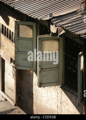 Shed made of galvanized sheet for the workers working on construction site, India Stock Photo