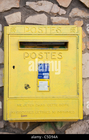 Yellow French Post Box (postes) in Antibes, Cote d'Azur, France. Stock Photo