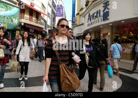 MACAU Street scene in downtown Macau with shoppers and tourists from mainland China. photo by Sean Sprague Stock Photo