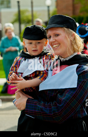 Dutch mother and child in traditional Dutch dress in Holland, Michigan, USA. Stock Photo