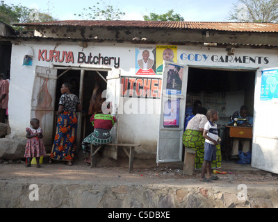 TANZANIA Street scenes in Mabatini, Mwanza. Butchers and garment shop. photograph by Sean Sprague Stock Photo