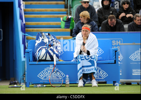 Petra Kvitova wraps up during a break in play in the final of the Aegon International 2011 Stock Photo