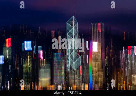 Hong Kong skyline at night with abstract blurred movement of lights Stock Photo