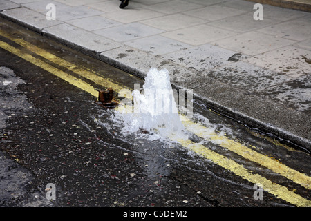 Water mains leak Stock Photo - Alamy