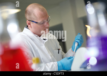 Wednesday 6th July 2011 Lab technician using a pipette at the Leeds Metropolitan University Bio Chemistry Laboratories. Stock Photo