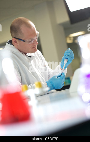Wednesday 6th July 2011 Lab technician using a pipette at the Leeds Metropolitan University Bio Chemistry Laboratories. Stock Photo