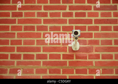 Brick wall with CCTV camera Stock Photo