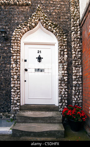 GREENHITHE, KENT, UK - JUNE 26, 2011:  Door in building in rough and knapped flint the High Street Stock Photo