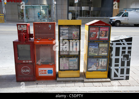 newspaper free and paid vending boxes toronto ontario canada Stock Photo