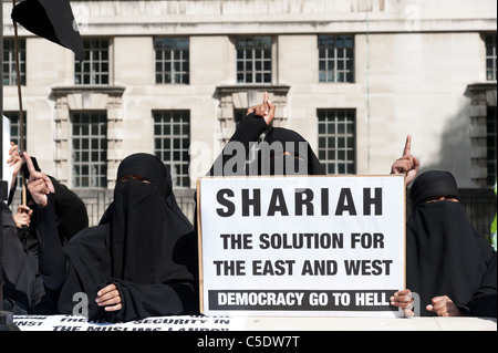 Extremist fundamentalist Muslim women wearing the niqab demonstrating for Shariah law in London, UK Stock Photo