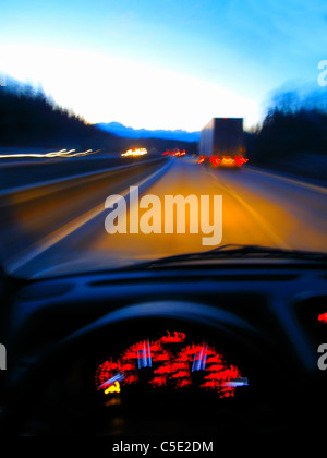 Close-up of dashboard with view of vehicles on the street through windshield