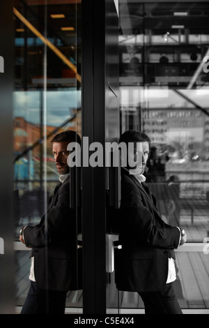 Creative shot of a black and white middle-aged businessman with colored reflection