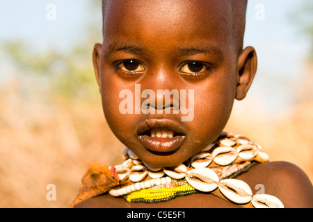 Portrait of a Hamer child at a village near Turmi in the Lower Omo Valley, Southern Ethiopia, Africa. Stock Photo
