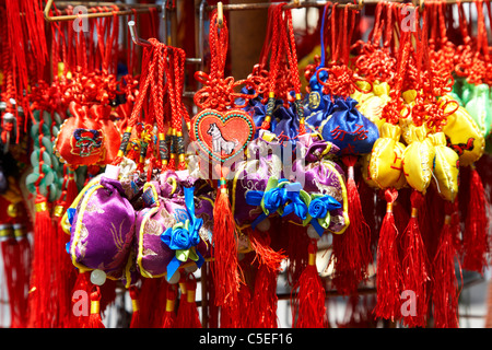 red and gold chinese lucky charms for sale in chinatown toronto ontario canada Stock Photo