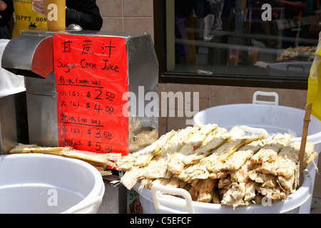 fresh sugar cane juice for sale from a street vendor in chinatown toronto ontario canada Stock Photo