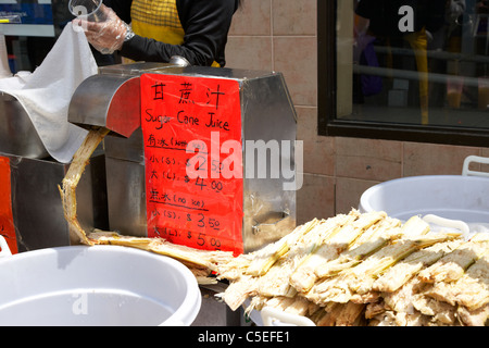 fresh sugar cane juice for sale from a street vendor in chinatown toronto ontario canada Stock Photo