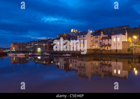 Whitby harbour at night, North Yorkshire, UK Stock Photo