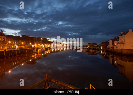 Whitby harbour at night, North Yorkshire, UK Stock Photo