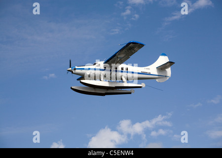 A de Havilland Canada DHC-3 Otter float plane or airplane flies over Puget Sound in the state of Washington Stock Photo