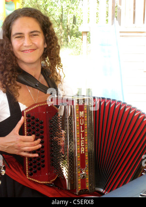 young lady playing the accordion Stock Photo