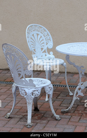 White decorative chairs in courtyard Stock Photo