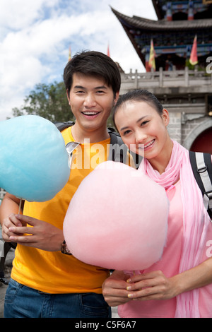 Young Couple with Cotton Candy, Dali Stock Photo